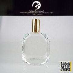 Clear glass perfume bottle with golden aluminum sprayer top