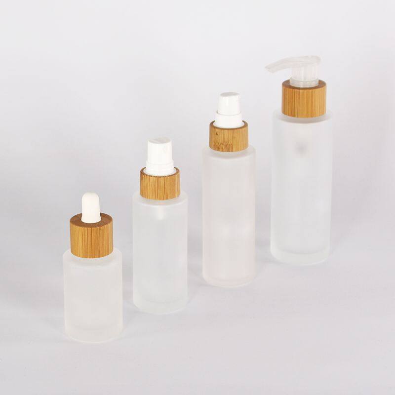 30ml 60ml 100ml 120ml custom round clear fancy glass cosmetic face mist spray bottle 2oz hair oil pump bottles with bamboo cap