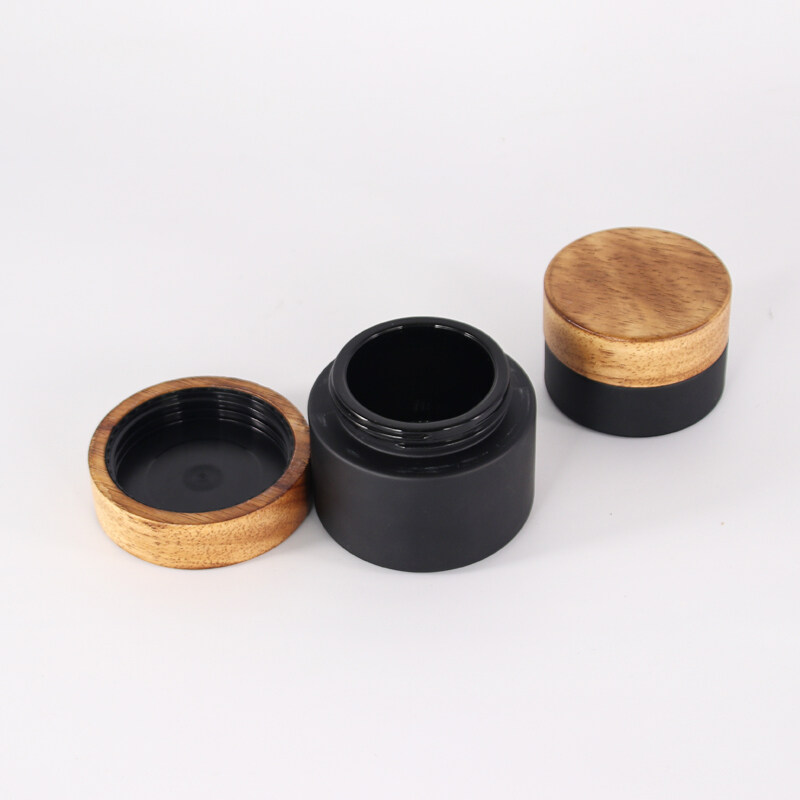 hot concentrate matte black skin beauty wood cover bamboo glass jar with bamboo wooden CR screw lid child resistant packaging