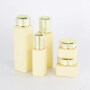Wholesale luxury skin care body lotion 30ml 100ml 150ml matte yellow glass bottles cosmetic cream jars 30g 50g with golden caps