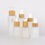 high quality frosted cream glass bottle with bamboo pump cap