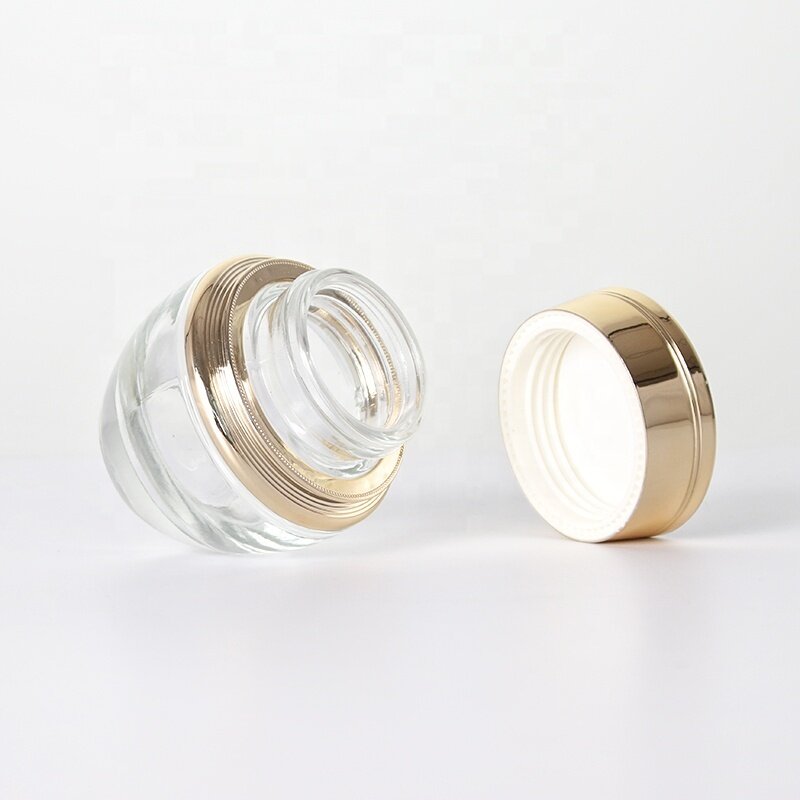 Luxury golden lid glass jars for skin care storage thick bottom stylish design clear jars customization