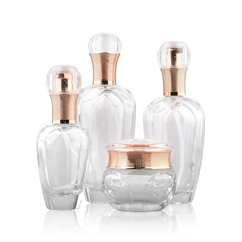 Luxury clear glass lotion pump bottles and jars with golden cap