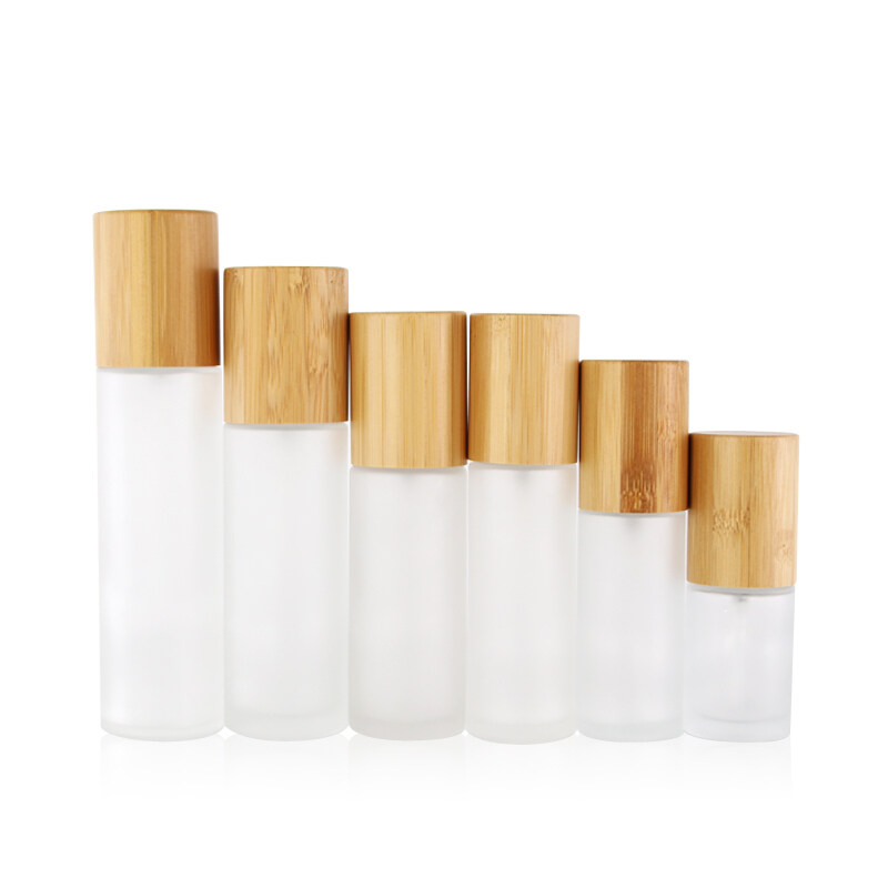 sprayer bottle bamboo lid essential oil clear frosted glass bottles,cosmetic glass bottle
