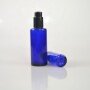 Blue cosmetic bottle with black plastic dropper for essential oil