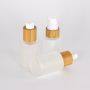 30ml 60ml 100ml 120ml custom round clear fancy glass cosmetic face mist spray bottle 2oz hair oil pump bottles with bamboo cap