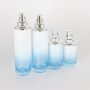 New Arrival painted gradient blue glass skin care bottles with lotion pumps cream jars with silver caps cosmetic packages