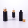 Wholesale  Matte Black Glass Dropper Bottles Glass Essential Oil Bottles with bamboo lids cosmetic packages and containers