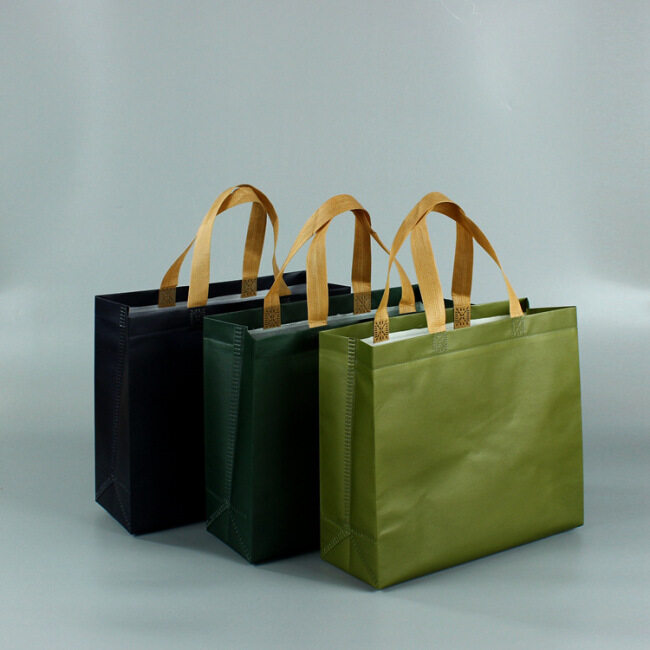 プラスチックコーティングされた不織布子供用ハンドバッグカスタム紳士服および婦人服店のショッピングバッグ、環境保護バッグ、カスタム印刷されたロゴ